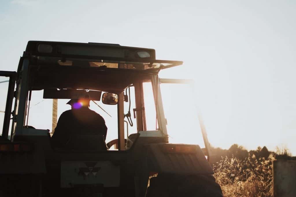Man in tractor farming
